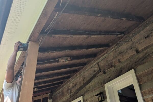 Covered porch ceiling framing and electrical rough-in during a home renovation in Dickson County