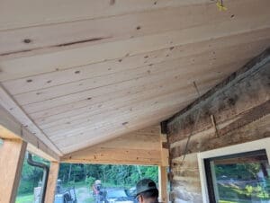 New tongue-and-groove wood ceiling on a covered porch built by a custom home builder in Middle Tennessee.